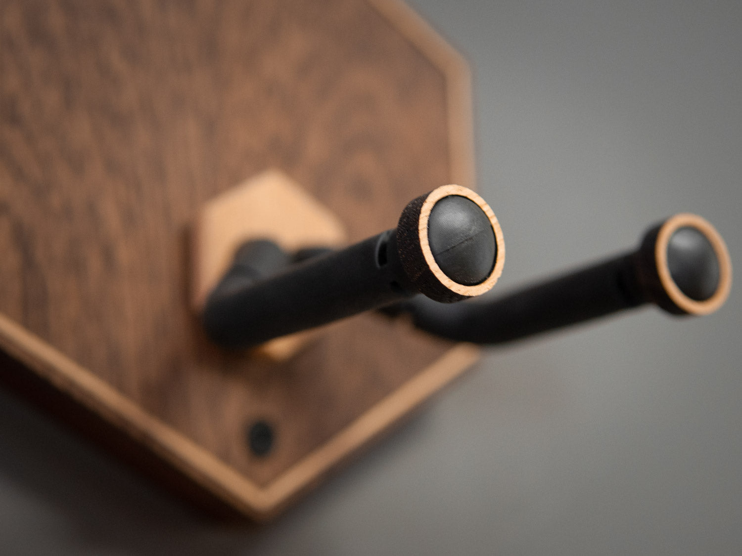 Light oak details of a guitar wall mount